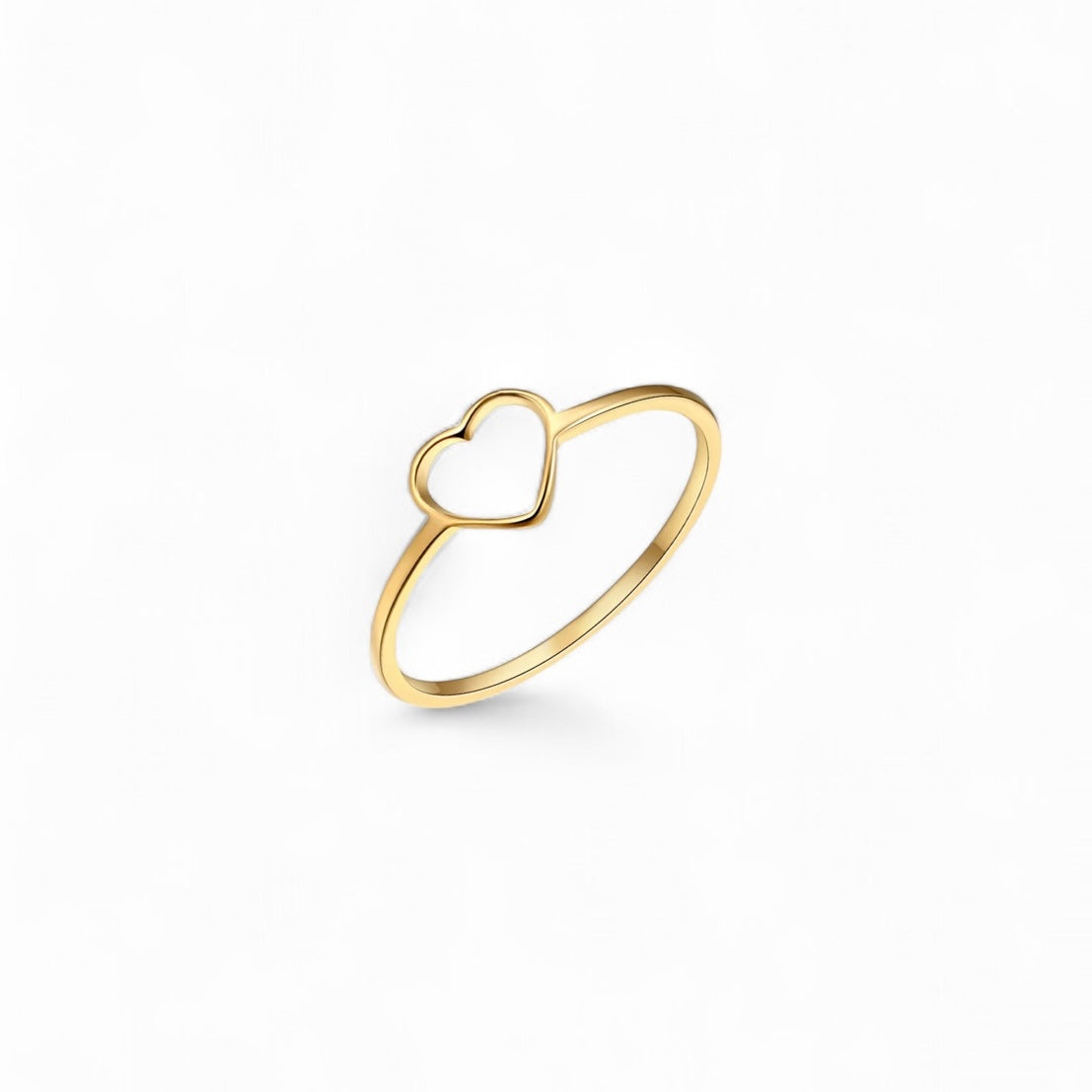 Gold heart-shaped ring on a white background