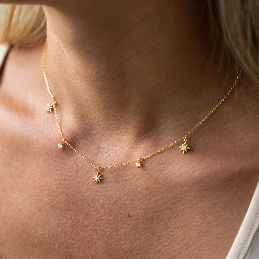 Delicate gold chain with detailed diamond stars