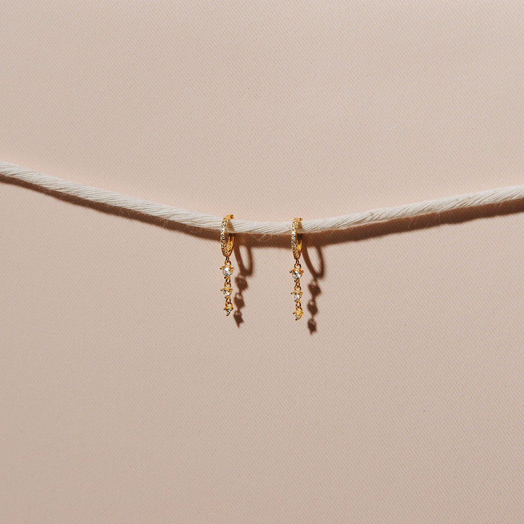 gold crystal detailed hoop with hanging layered crystal earrings