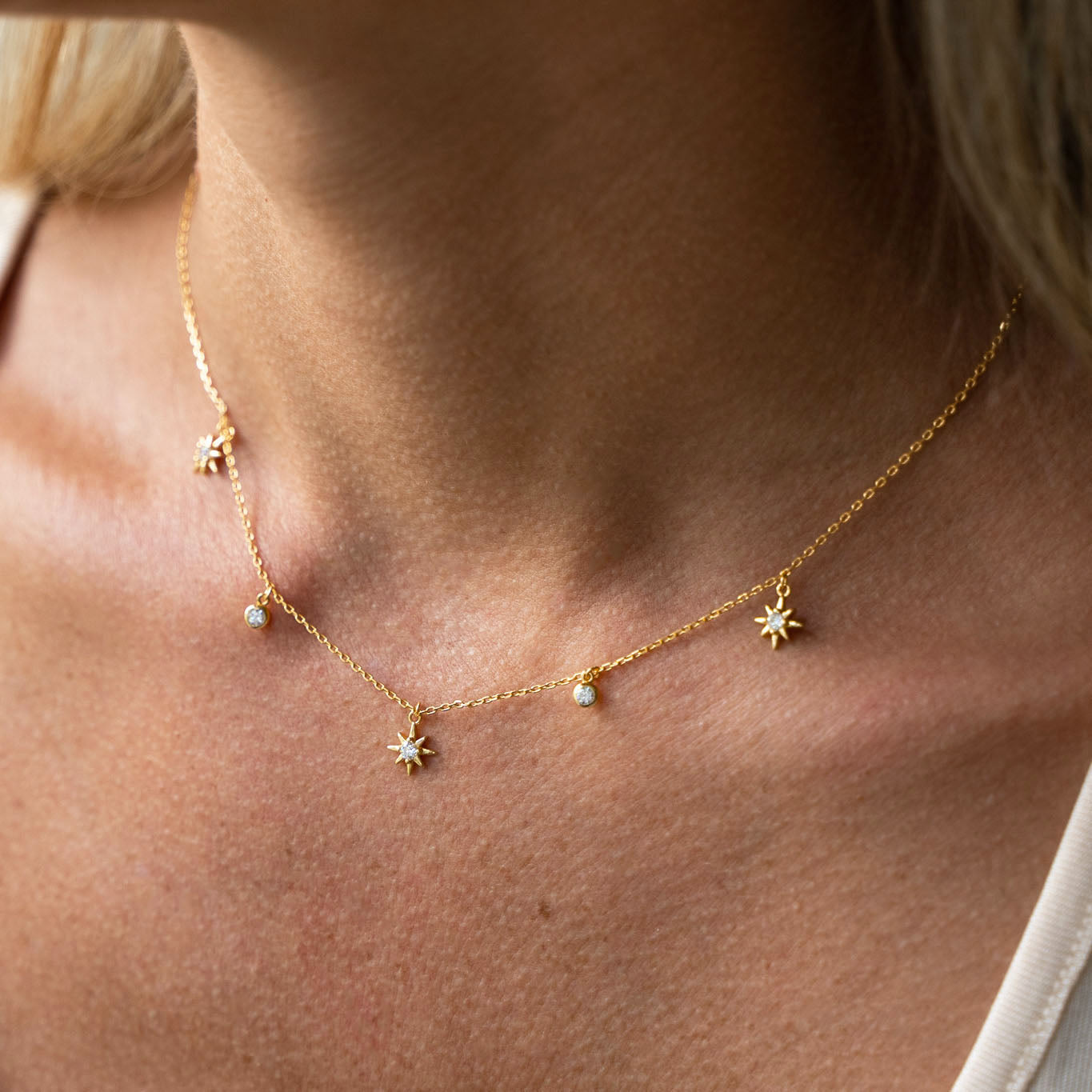 Delicate gold chain with detailed diamond stars