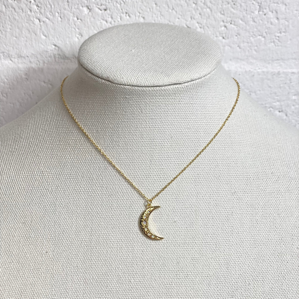 gold crescent moon with detailed crystals 